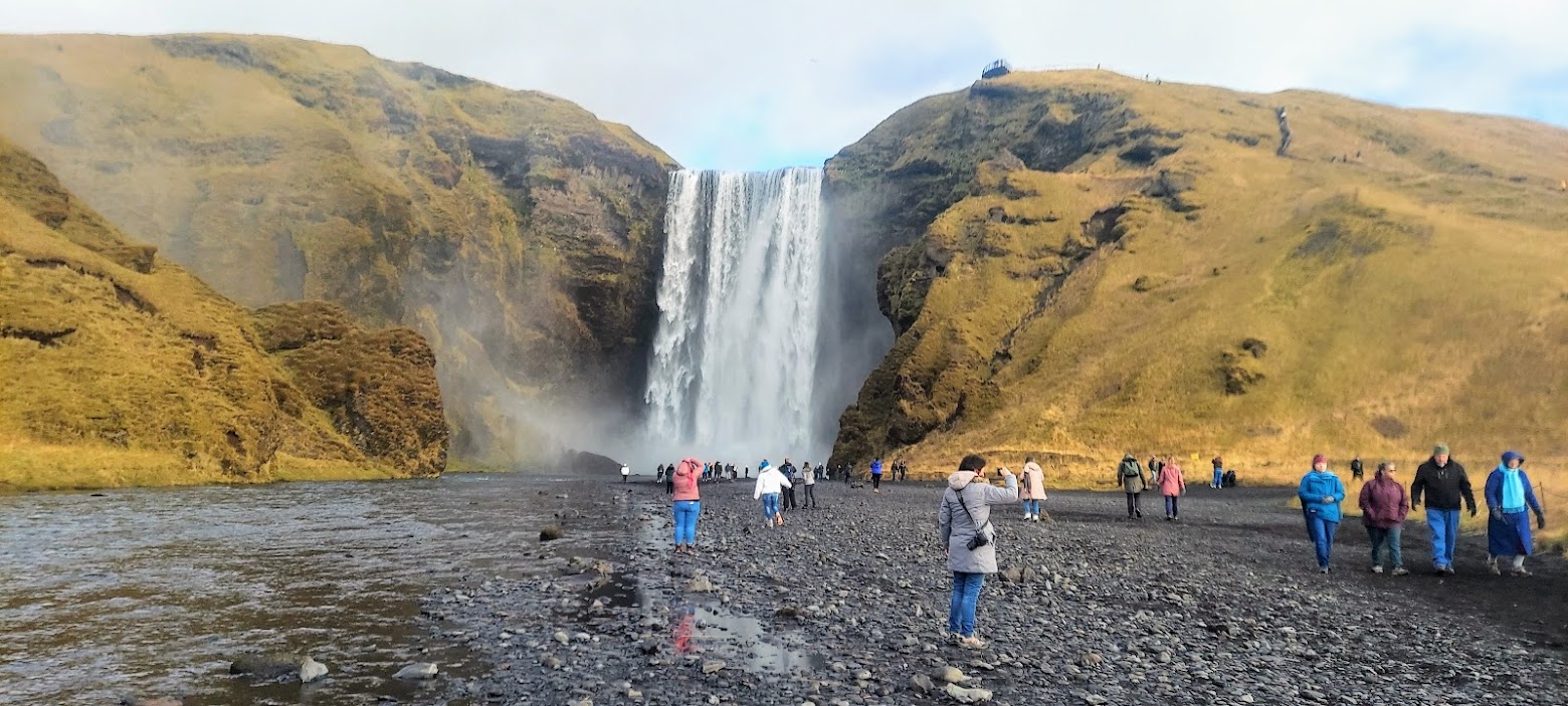 South Iceland Waterfalls and Black Sand Beach: Skogafoss Waterfall is one of the biggest waterfalls in Iceland, with a drop of some 60 meters and a width of 25 meters. On the right side (facing the waterfall), steps lead up to an observation platform above Skógafoss