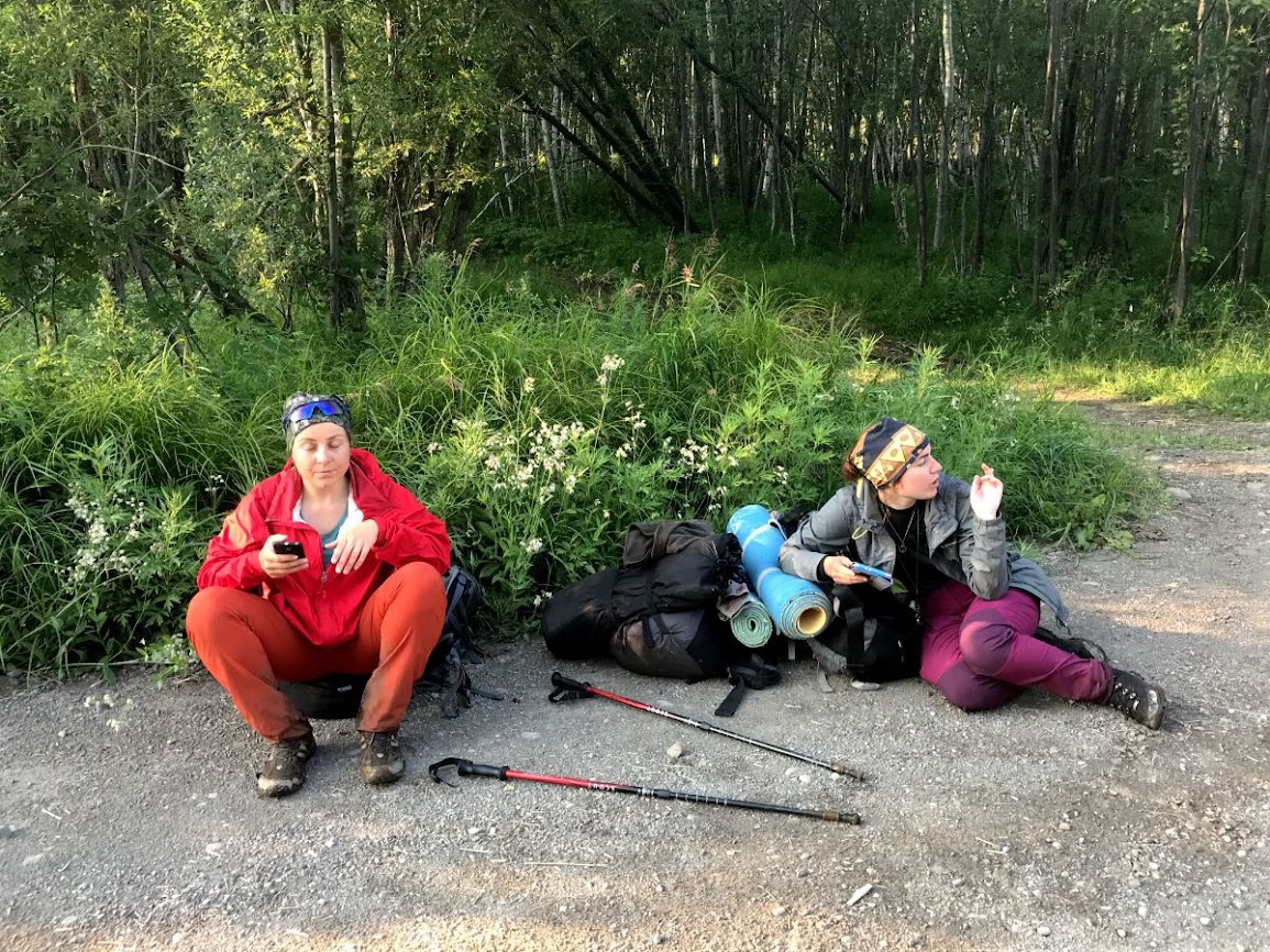 trekking nalychevo national park kamchatka girl hikers resting by road side