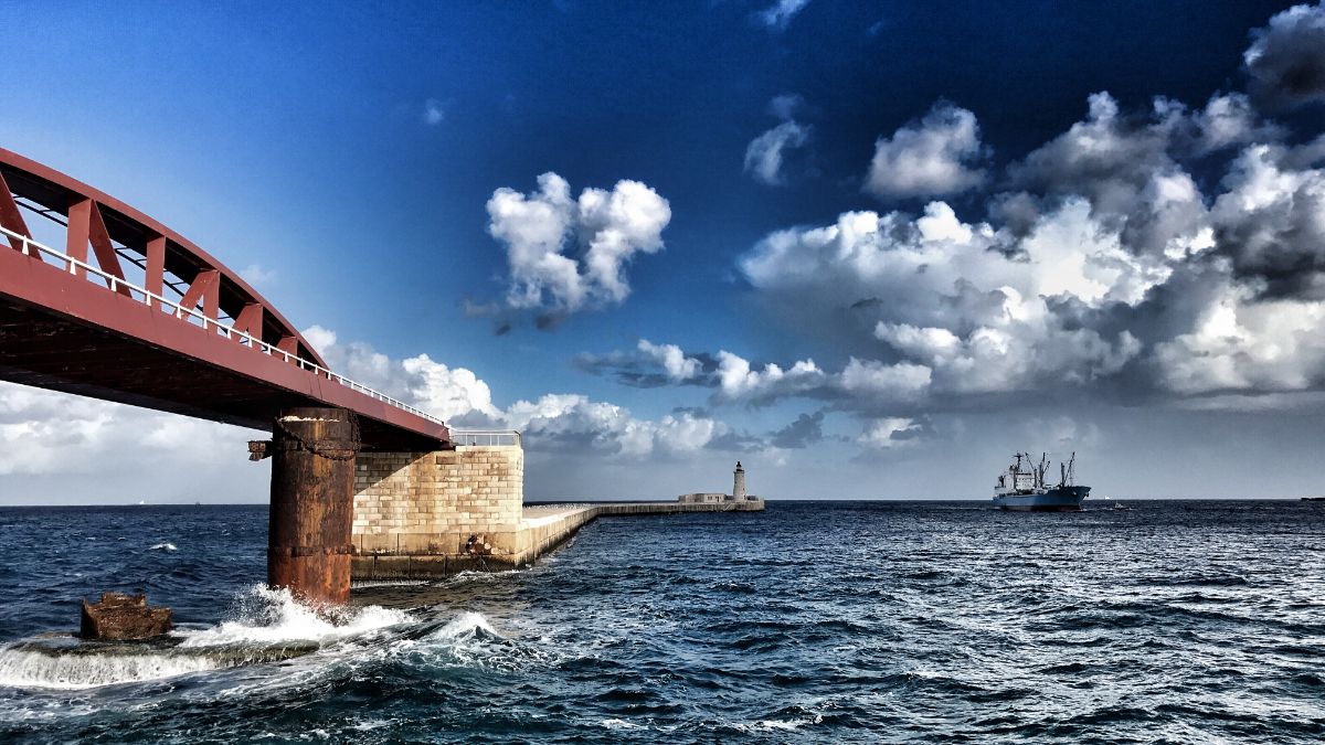 valetta malta breakwater bridge and lighthouse