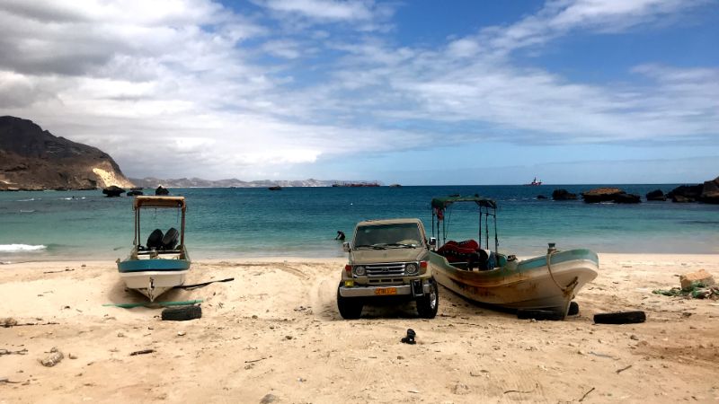 al fazayah beach salalah oman Car and fishing boats resting on the beach