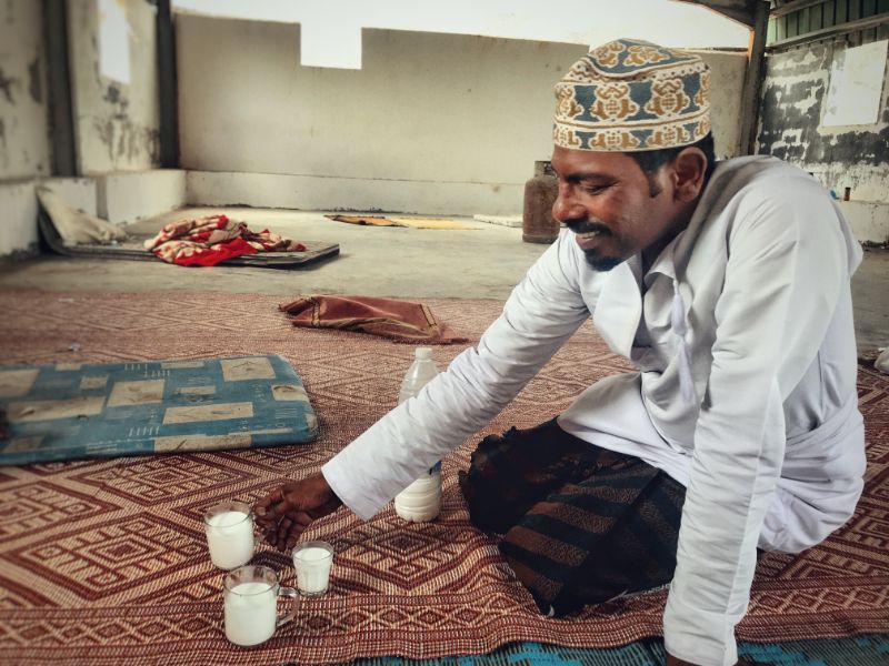 al fazayah beach salalah oman drinking camel milk