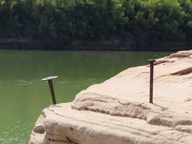 Axles embedded in the sandstone for mooring lines