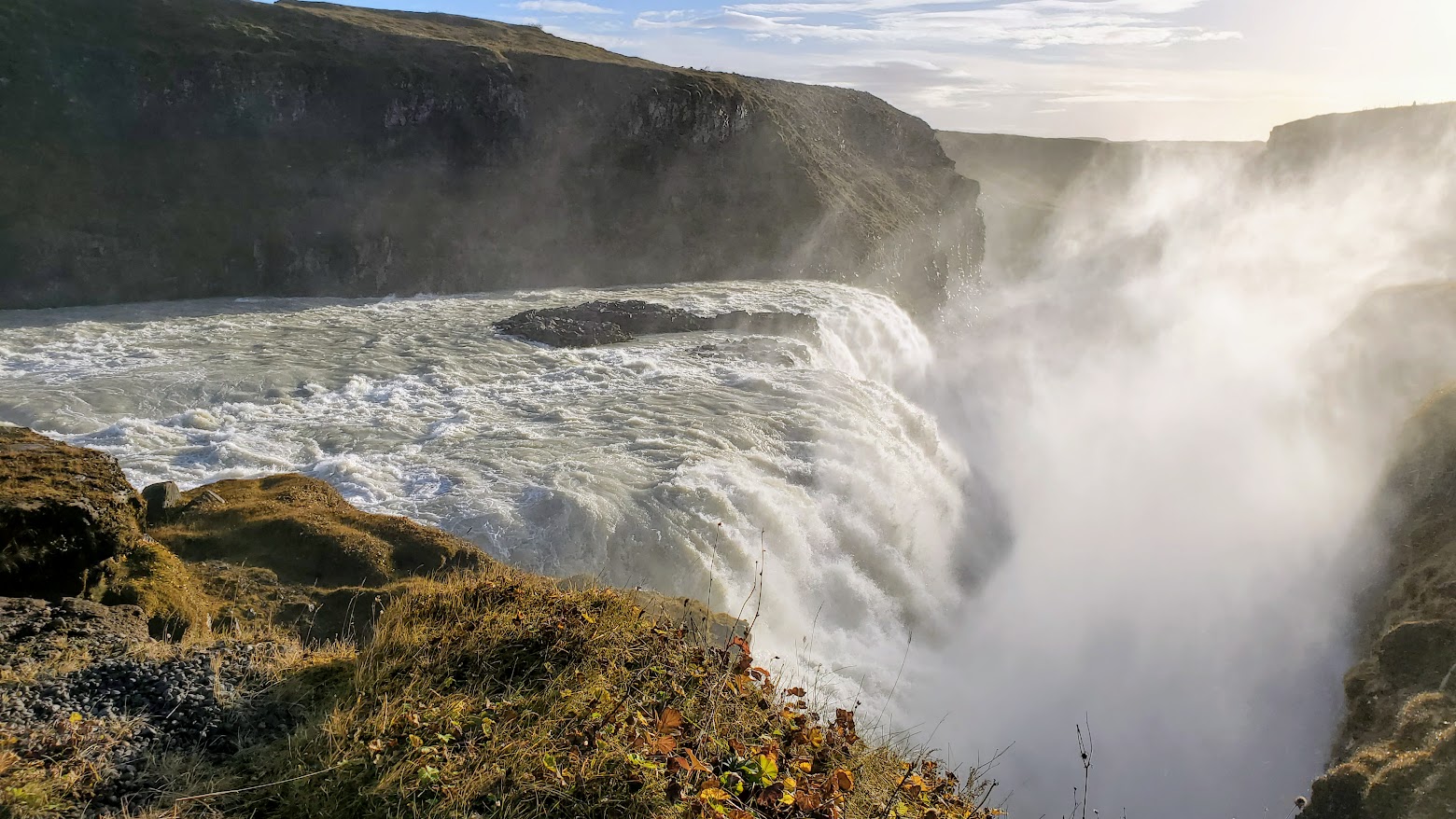 Golden Circle Highlights, Iceland: Gullfoss, or Golden Falls, unique as the waterfall plunges into a gorge so it seems to disappear into the earth