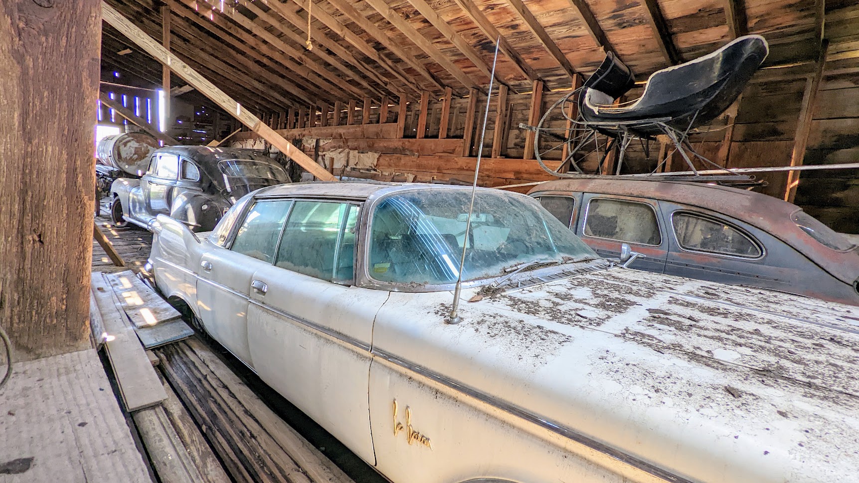 Planning a Trip to the Painted Hills - we opted to take 97 as part of the Journey Through Time Scenic Byway from Portland through Shaniko where we saw this across the street the Wagon Yard - the Shaniko Livery Barn, free to visit/requested donation box viewing of vehicles from the past