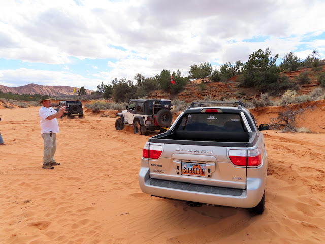 A train with two Jeep engines and a Subaru boxcar