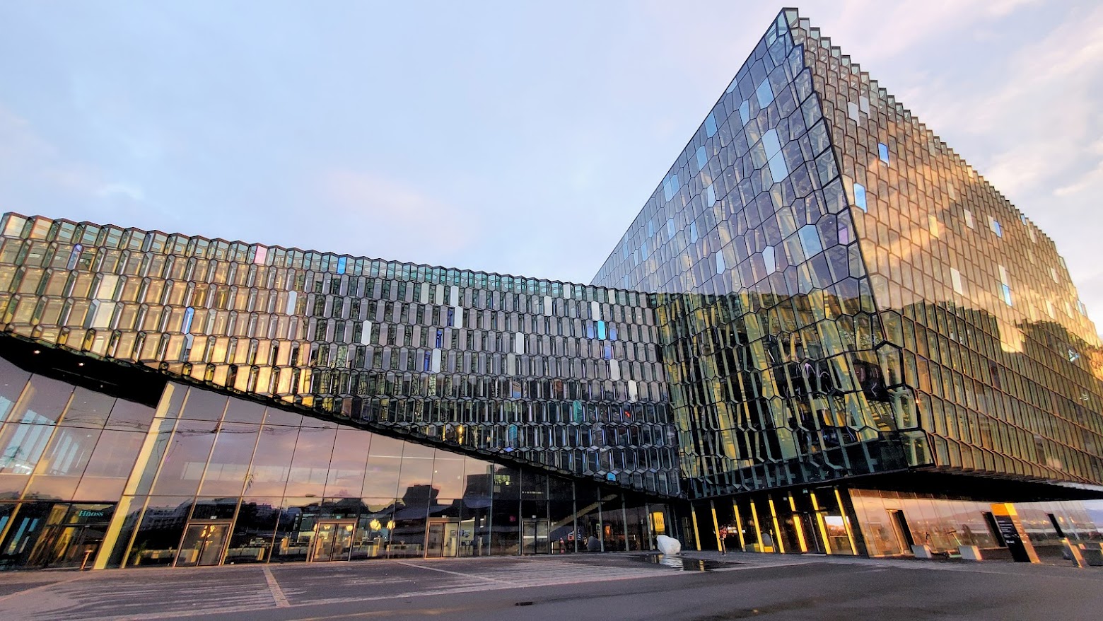 In Reykjavik Iceland, one early morning thing to do that is free is visiting Harpa Concert Hall. The honeycomb glass exterior is mesmerizing how the windows change colors in daylight or in the night.