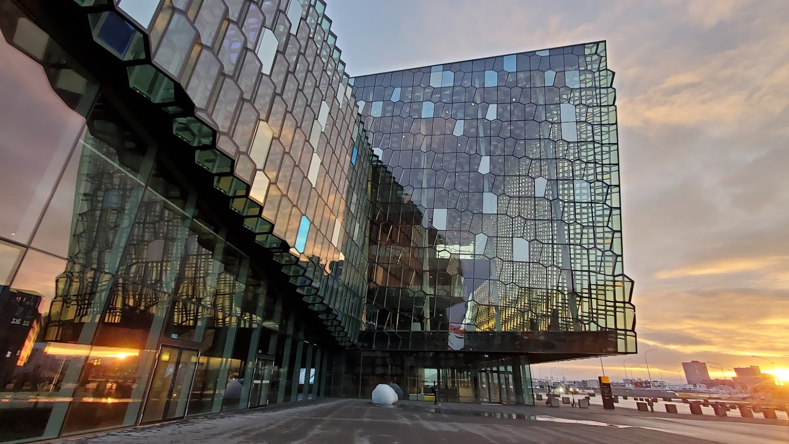 In Reykjavik Iceland, one early morning thing to do that is free is visiting Harpa Concert Hall. The honeycomb glass exterior is mesmerizing how the windows change colors in daylight or in the night.