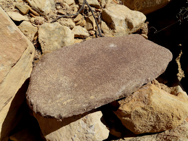 Metate found on a steep, rocky slope