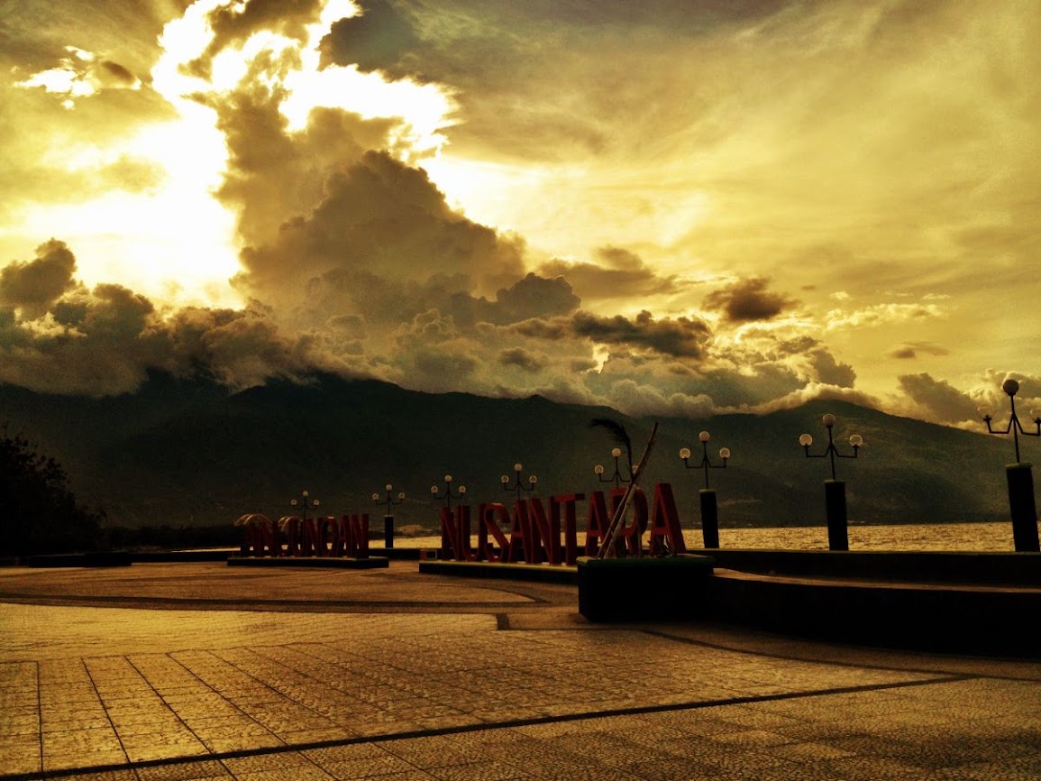 palu, sulawesi main square and view of mountains in the background 