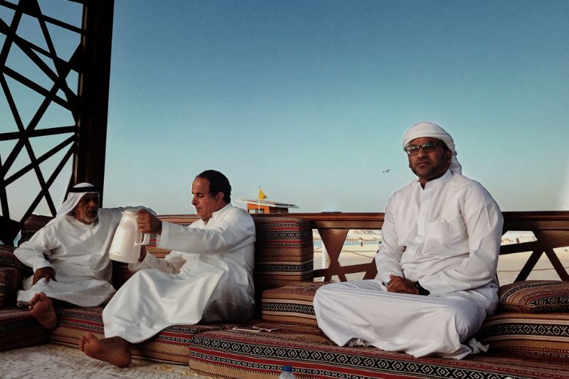 beach near jumeirah arab local residents drinking tea at kiosks