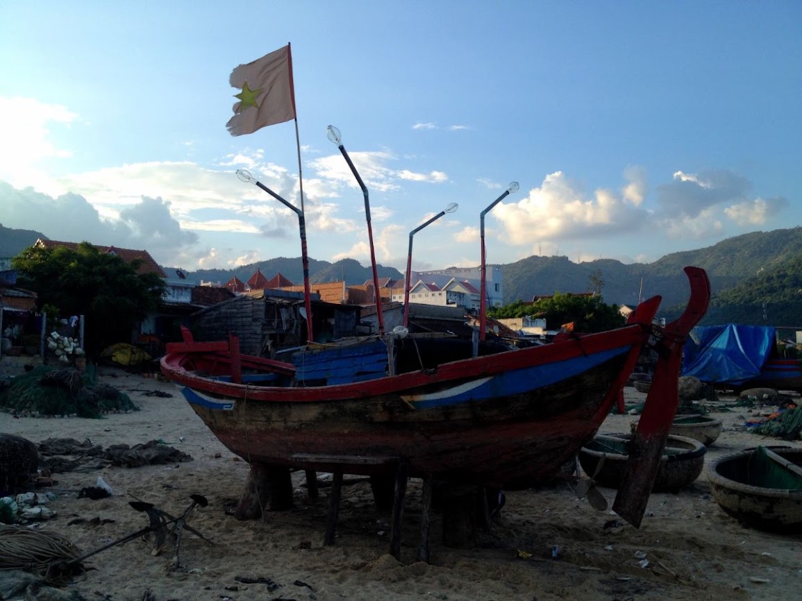 fishing boat with vietnamese flag at dai lanh beach