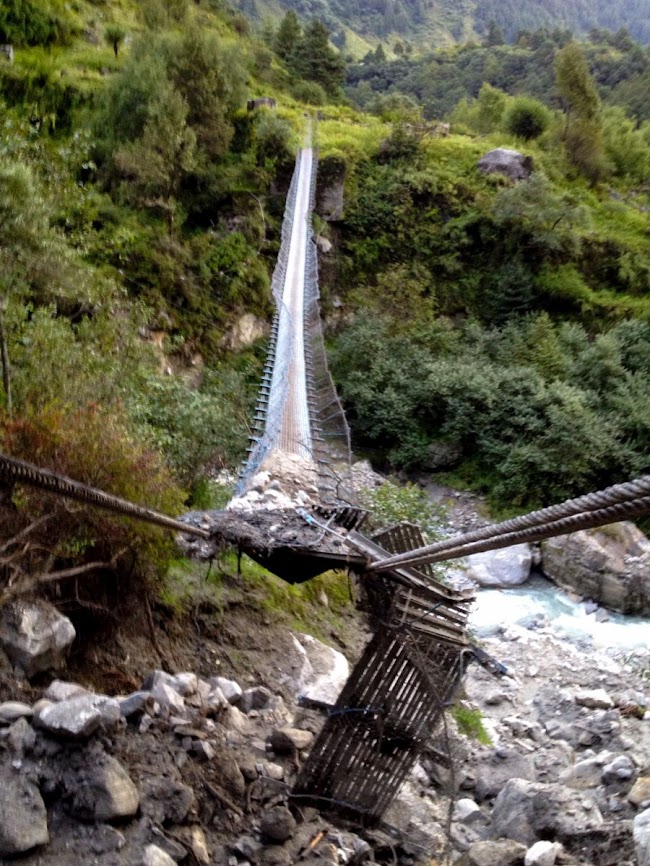 broken hanging bridge in annapurna 