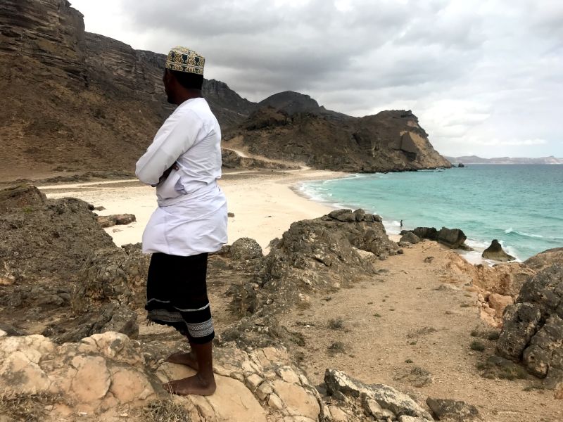 arab man at beach in al fazayah near salalah oman