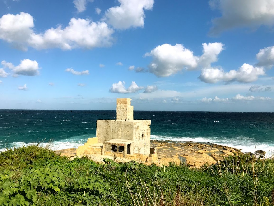 cycling in malta xghajra small white building before the sea