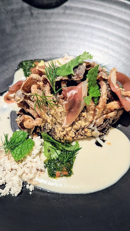 Urban Farmer Mushroom Dinner, Hon shimeji mushroom conserva, coconut and cashew broth, crispy chanterelles, apple, duck prosciutto served with a white matsutake tea by Chef Ryan Rau of Urban Farmer Denver