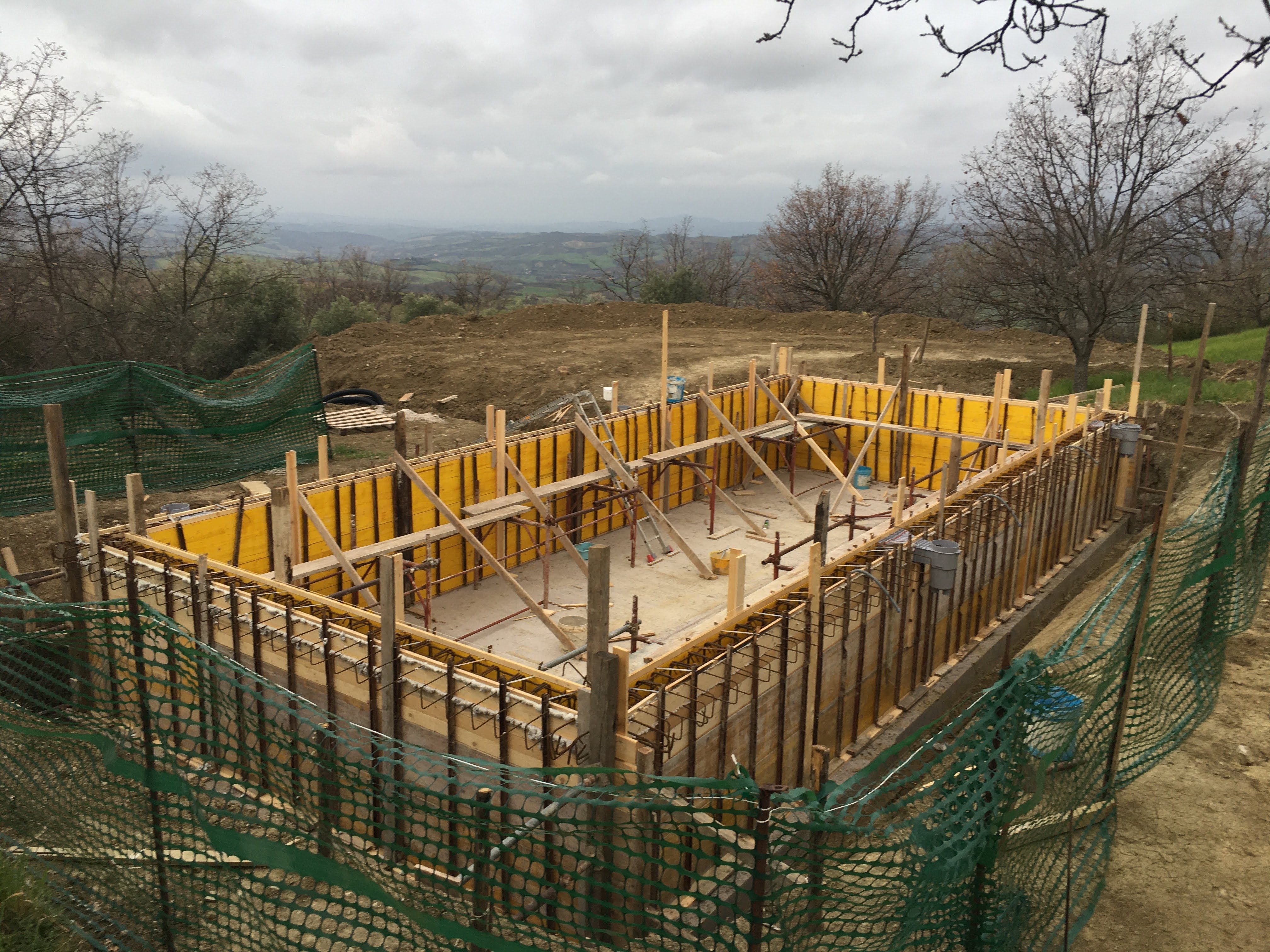 Constructing Santa Pia swimming pool, wood formwork preparation. Carpentry skills are required to form a perfect swimming pool design