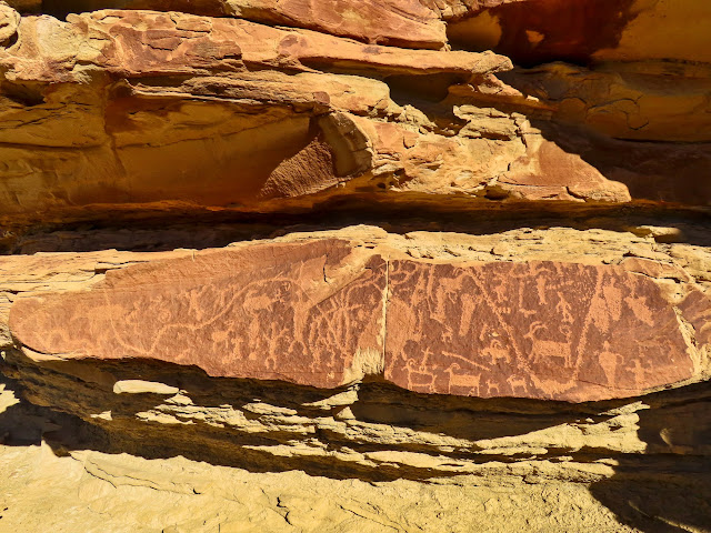 Petroglyph panel with a long line pecked through it