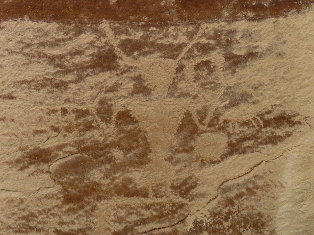 Weathered horned figure