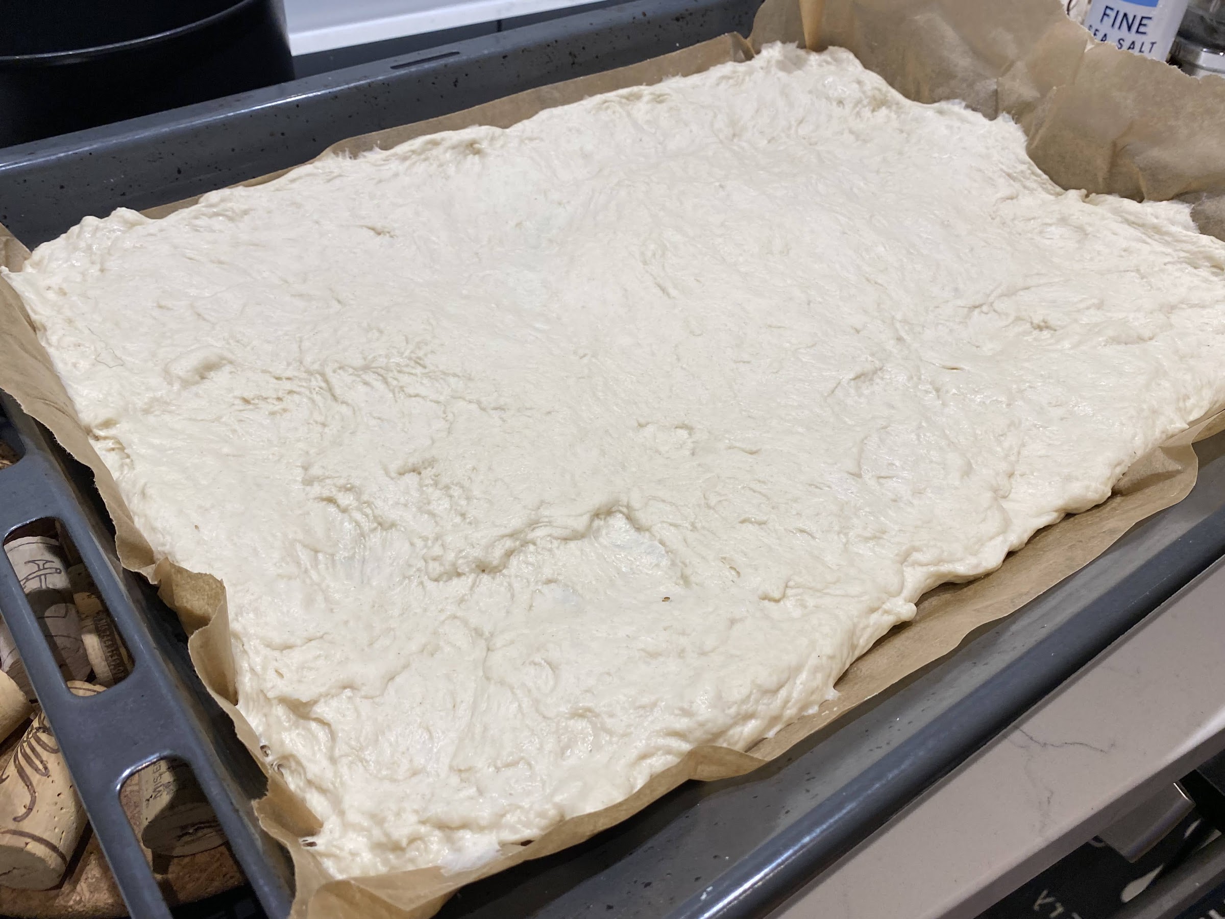 Spread the pizza dough on the pan