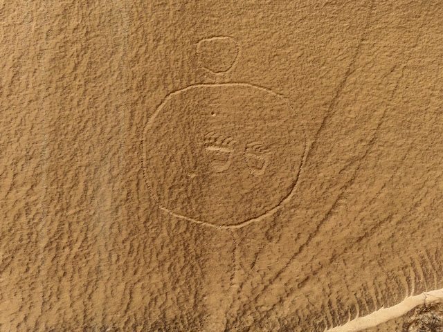 Circles, bear prints, and a Tom Allred inscription