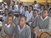 CROWDED: Pupils at Nakampe Primary School in Bolobedu are packed into a classroom because the builders of a new block of classrooms allegedly refuse to hand over the keys to the principal, making it difficult to conduct proper learning and teaching. Pic. MICHAEL SAKUNEKA . 02/02/2010. © Sowetan.