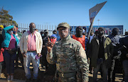 The president of Soweto Parliament Nhlanhla Lux addresses member of the community security unit near Maponya Mall in Soweto. The movement is a non-political organisation that focuses on community issues in and around Soweto. 