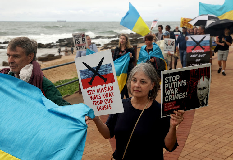 People protest in Umhlanga against military exercises involving South African, Russian and Chinese forces.