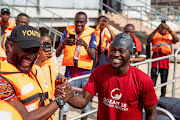 Akinrodoye Samuel shakes hands with Mobolaji Ogunlende of the Commission for Youths and Social Development, ahead of his attempt  to swim the 11.8km stretch of the Third Mainland Bridge, advocating for the theme 'Swim Against Suicide And Depression' in Lagos, Nigeria, on March 30 2024.