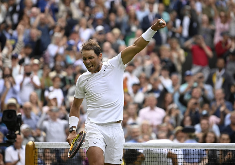 Spain's Rafael Nadal celebrates after winning his first round match against Argentina's Francisco Cerundolo at Wimbledon on June 28, 2022