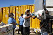 The African Children’s Feeding Scheme  goes  door to door to deliver food parcels to people in need in Tsakane, near Brakpan in Gauteng.