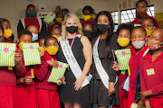 Mrs SA semi-finalists Jo Jackson (left) and Zikhona Ngxata visited Aqua Vista Primary School, East London, to speak about gender-based violence and hand out whistles to students as part of the “Blow the Whistle against Woman Abuse” campaign.