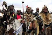 President Jacob Zuma and Chief Mangosuthu Buthelezi on either side of King Goodwill Zwelithini on his wedding day to Zola Mafu on Saturday in Ulundi, KwaZulu Natal. Photo Thulani Mbele