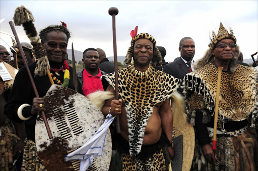 President Jacob Zuma and Chief Mangosuthu Buthelezi on either side of King Goodwill Zwelithini on his wedding day to Zola Mafu on Saturday in Ulundi, KwaZulu Natal. Photo Thulani Mbele