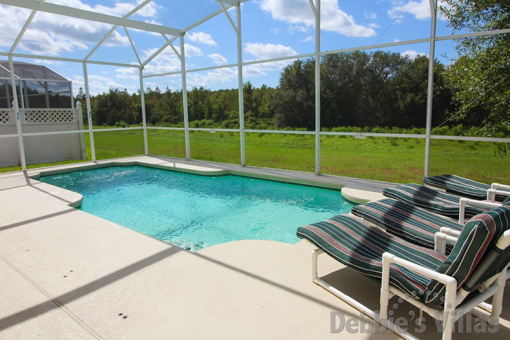 Private west-facing pool deck with woodland view on Highlands Reserve