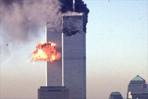 A hijacked commercial plane crashes into the World Trade Center 11 September 2001 in New York.