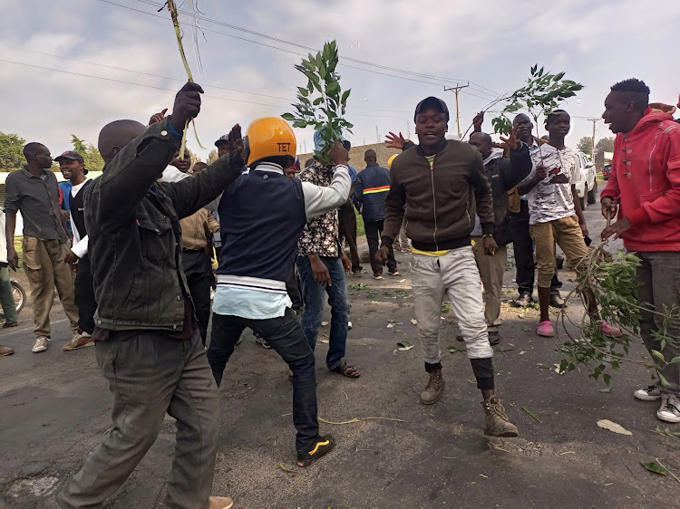 A section of voters in Rongai Constituency block the Nakuru-Kabarak road on August 9, 2022 to protest the cancellation of MP election in the area over alleged mix-up of the ballot papers.