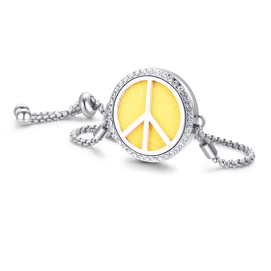 Bracelet vaporisateur ailes et notes de musique en alliage, un accessoire élégant qui parfume et orne votre poignet avec style et la mélodie.