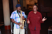 Mpho Sithole member of legendary group African Jazz Pioneers posing with the only surviving member of Mahotella Queens, Hilda Tloubatla.