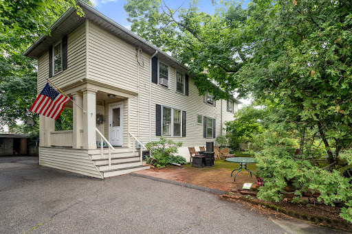 White house with porch and garden in this luxury house for sale in Arlington ($1,990,000)