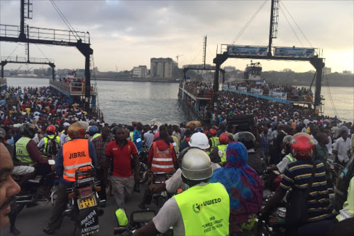 FULL TO THE BRIM: Hundreds of commuters cram onto two ferries at the Likoni crossing channel. Photo/ELKANA JACOB