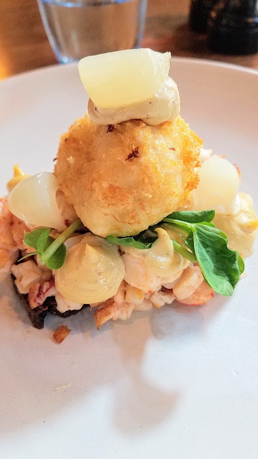 Restaurant Palaegade in Copenhagen offering traditional Danish smørrebrød and snaps - here is the specialty of the house - a Tartar of lobster with crispy fried egg and cress