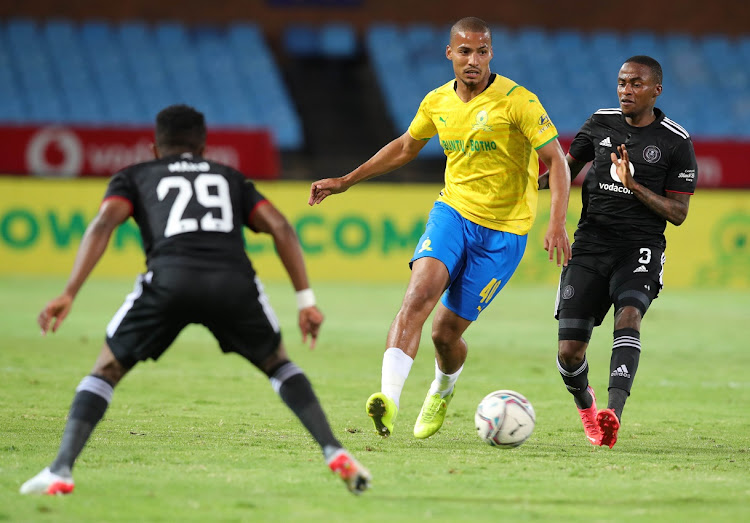 Rivaldo Coetzee of Mamelodi Sundowns is challenged by Thembinkosi Lorch of Orlando Pirates in the DStv Premiership match at Loftus Versfeld in Pretoria on December 17 2021.