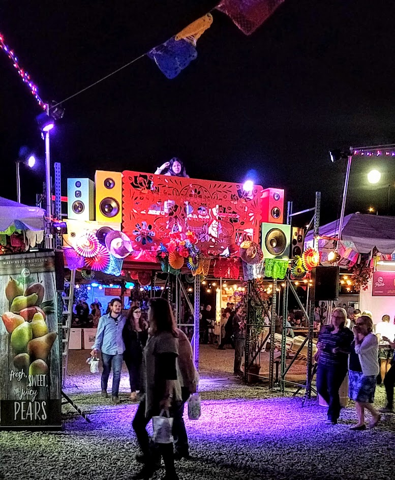 Feast PDX 2016 Night Market DJ above the people and the moon rising behind her