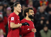 Liverpool's Mohamed Salah celebrates scoring their second goal with Darwin Nunez against Wolves in the FA Cup.