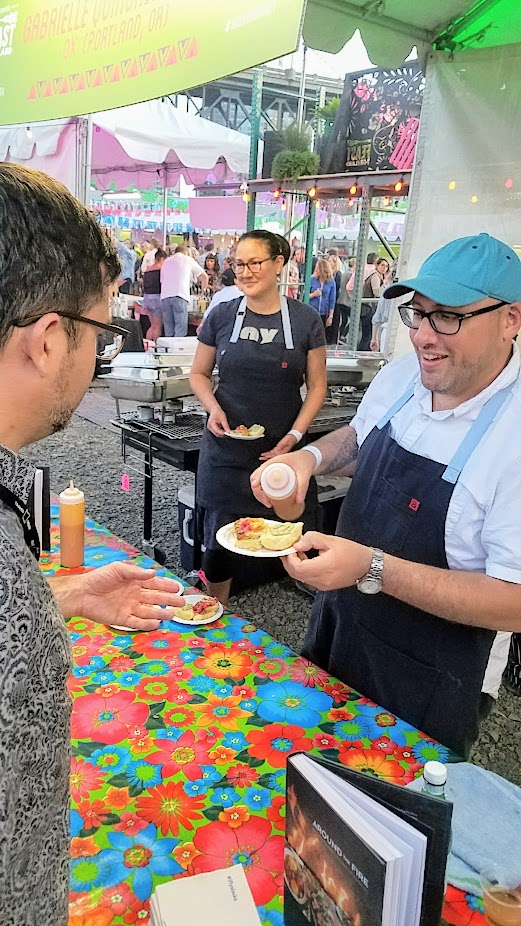 Recap of Feast Night Market 2017: Greg Denton and Gabrielle Denton from Ox bring Ecuadorian Roast Pork Sandwich with pickled red onion and aji crielo mayo