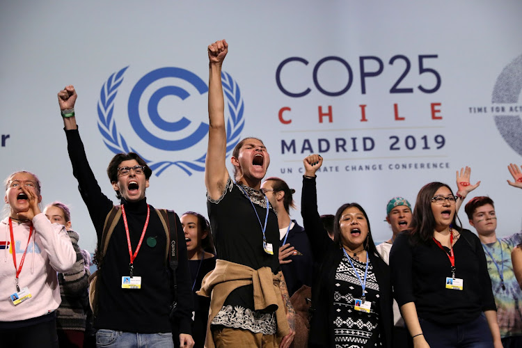 Young climate activists shout on stage at the High-Level event on Climate Emergency during the U.N. Climate Change Conference (COP25) in Madrid, Spain December 11, 2019.