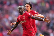 Sadio Mane of Liverpool celebrates with Trent Alexander-Arnold in The FA Cup semifinal against Manchester City at Wembley Stadium in London on April 16, 2022.