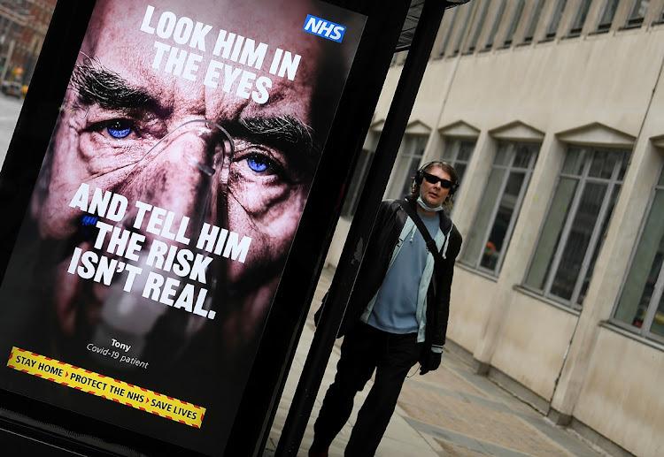 A British government public health information sign is seen on bus shelter amid the spread of COVID-19) in London on January 27 2021. REUTERS/Toby Melville