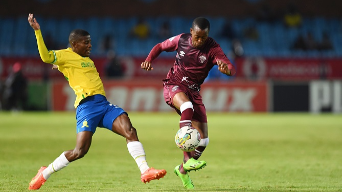 Swallows FC defender Mbulelo Lukhubeni challenges for the ball with Neo Maema of Mamelodi Sundowns in their DStv Premiership match at Loftus Versfeld in Pretoria on January 3.