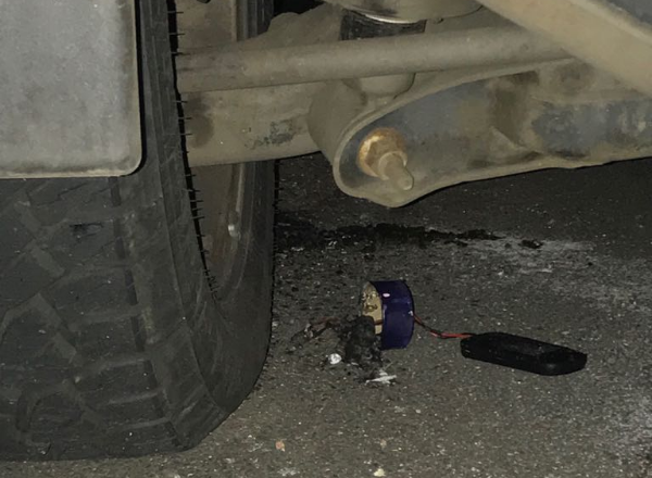 An incendiary device that was placed under one of two vehicles near the Greyville Racecourse in Durban on Saturday.